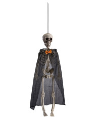 Squelette avec cape et papillon à suspendre, h. 40 cm env., avec étiquette volante / étiquette