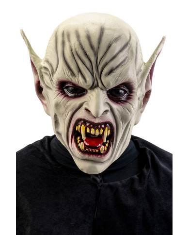 Masque horreur avec oreilles pointues et dents acérées en latex avec étiquette cartonnée pliée Masque horreur avec oreilles pointues et dents acérées en latex avec étiquette cartonnée pliée