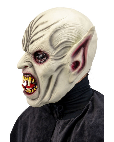 Masque horreur avec oreilles pointues et dents acérées en latex avec étiquette cartonnée pliée Masque horreur avec oreilles pointues et dents acérées en latex avec étiquette cartonnée pliée