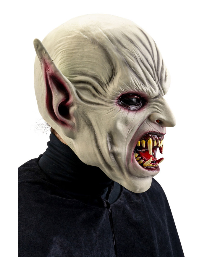 Masque horreur avec oreilles pointues et dents acérées en latex avec étiquette cartonnée pliée Masque horreur avec oreilles pointues et dents acérées en latex avec étiquette cartonnée pliée