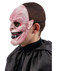 Masque monstre horreur avec canines en plastique dur avec étiquette cartonnée pliée