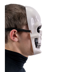 Masque squelette en plastique avec étiquette cartonnée pliée