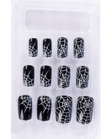Faux ongles adhésifs noirs avec toiles d’araignée dans une boîte