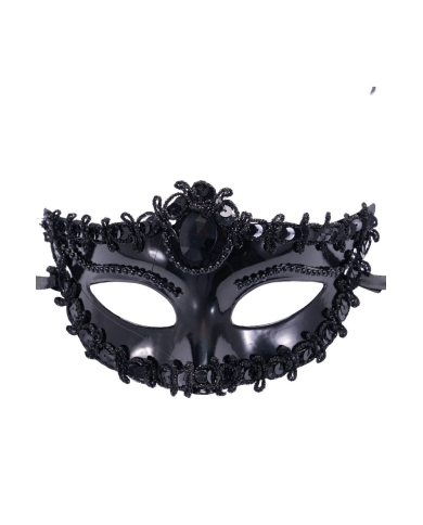 Maschera nera in plastica con decorazioni su cartoncino