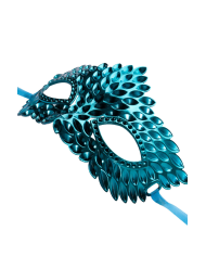 Blue carved mask in plastic on card