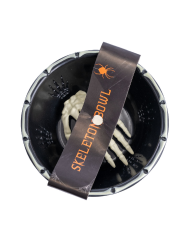 Black storage holder with plastic skeleton hand with hangtag/label