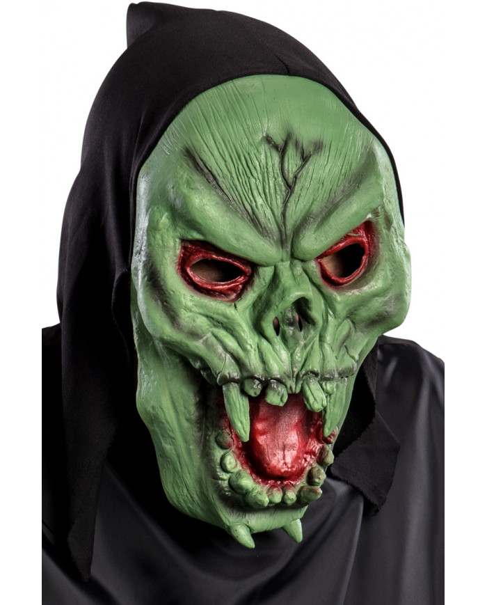 Soft pvc mask depicting a green skull with tongue and red eyes.