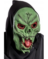 Soft pvc mask depicting a green skull with tongue and red eyes.
