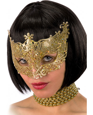Masque en plastique avec poudre de paillettes dorées dans une