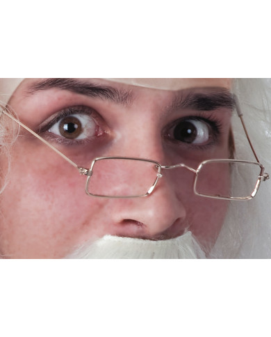 Brille aus Metall ohne Gläser auf Pappkarton Brille aus Metall ohne Gläser auf Pappkarton