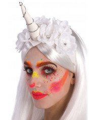 White unicorn headpiece decorated with flowers that is