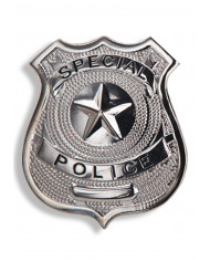 Badge policier en métal dans une pochette sur papier cartonné