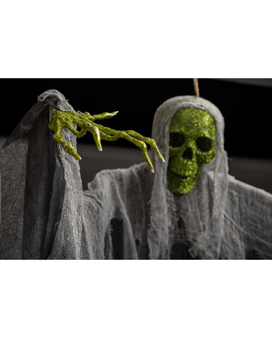 Skeleton with face and hands covered in green glitter.