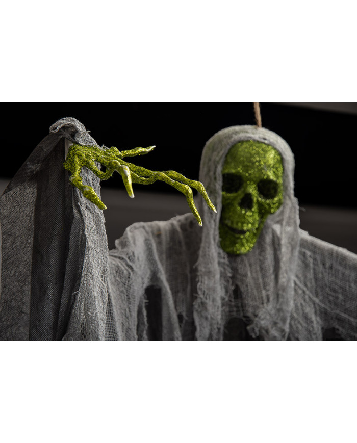 Skeleton with face and hands covered in green glitter. Skeleton with face and hands covered in green glitter.