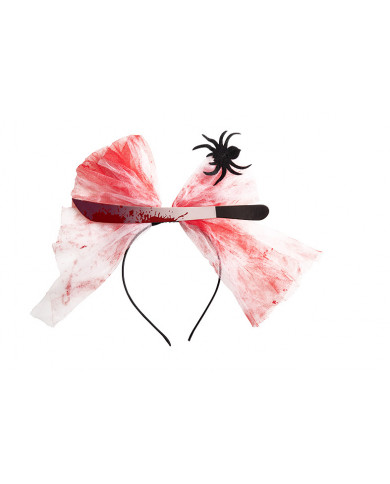 Plastic headband topped with a fake knife and tulle ribbon with