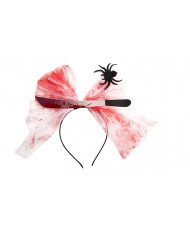 Plastic headband topped with a fake knife and tulle ribbon with