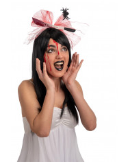 Plastic headband topped with a fake knife and tulle ribbon with