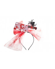 Plastic headband topped with fake hatchet and tulle ribbon with