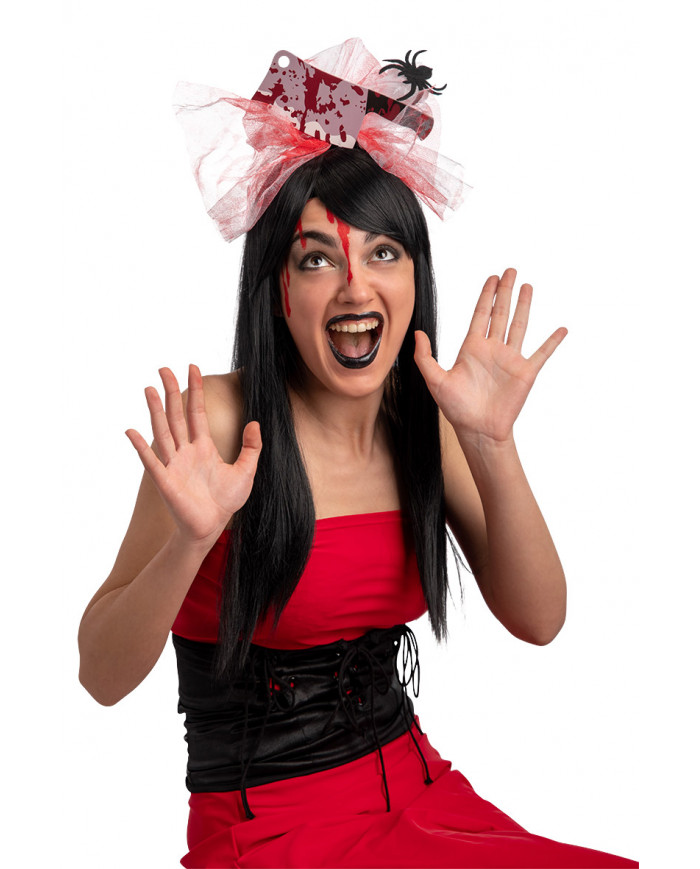 Plastic headband topped with fake hatchet and tulle ribbon with