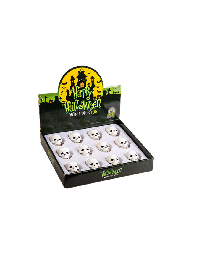 12 plastic wind-up horror skulls on a display stand, with each