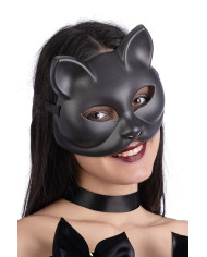 Schwarze Katzenmaske aus Plastik auf Pappkarton