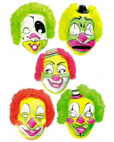 Assortment of plastic clown masks with fluorescent hair. They Assortment of plastic clown masks with fluorescent hair. They